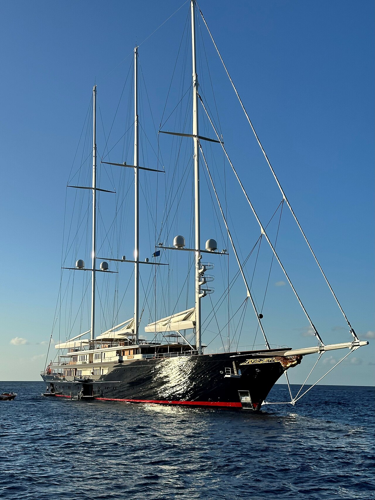 Koru — Jeff Bezos's 127-metre Oceanco. Three masts, Dykstra naval architecture, and a support yacht named Abeona.